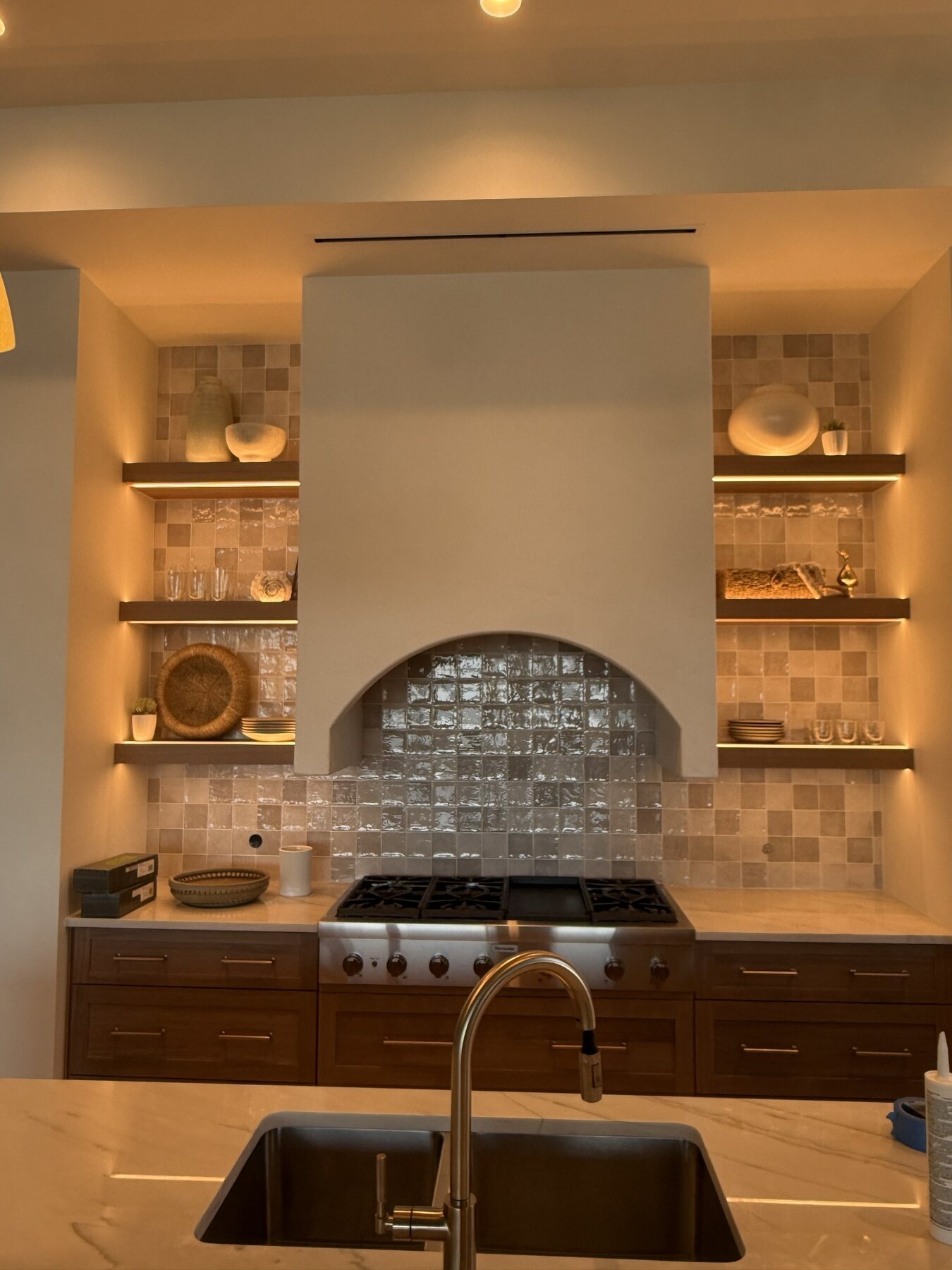 Tiled fireplace surround with built-in shelving